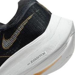 Nike Women's ZoomX Vaporfly Next % 2 Racing Shoe - Black/White/Metallic Gold Coin - Regular (B) 15 Nike Women's ZoomX Vaporfly Next % 2 Racing Shoe - Black/White/Metallic Gold Coin - Regular (B) -Step Vibe Shop CU4123 001 PHSYD002 1500
